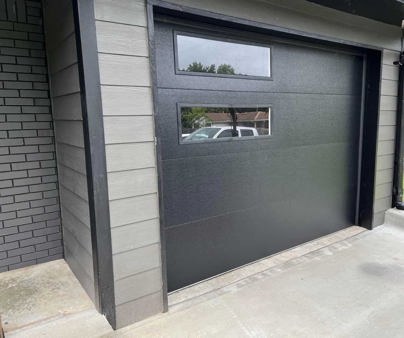 Modern garage door installed by Garsol Garage Solutions